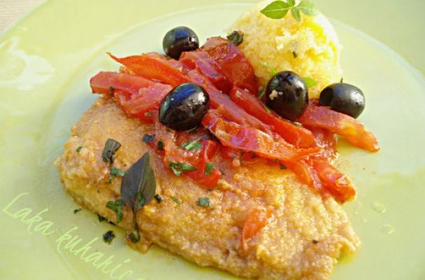 Cod with tomatoes, olives and polenta